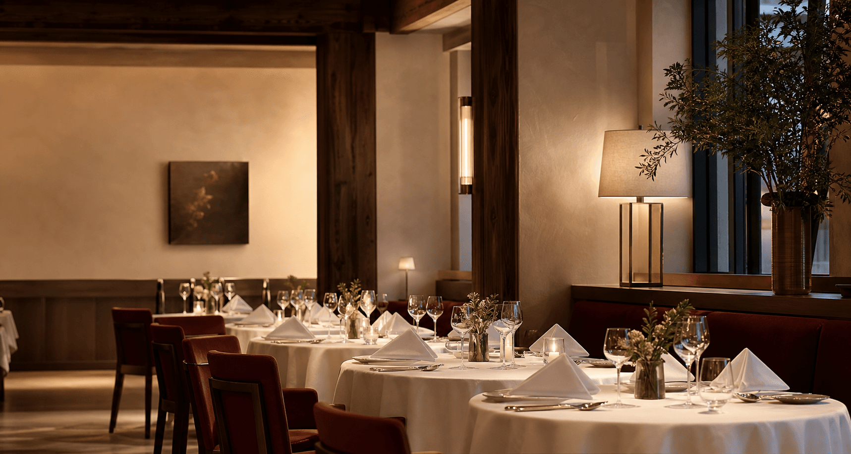 Elegant restaurant dining room set with pristine white table linens